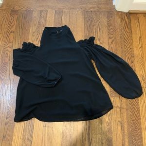 Fun and flirty open shoulder top. Perfect for date night!